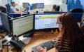 Employee with a headset working at their desk