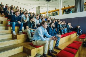 Audience listening to Jason Morjaria's speech at Connect & Preview event September 2025