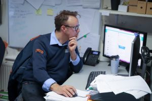 C. Anderson and Sons team member working at computer