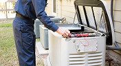 Engineer working on a generator repair outside