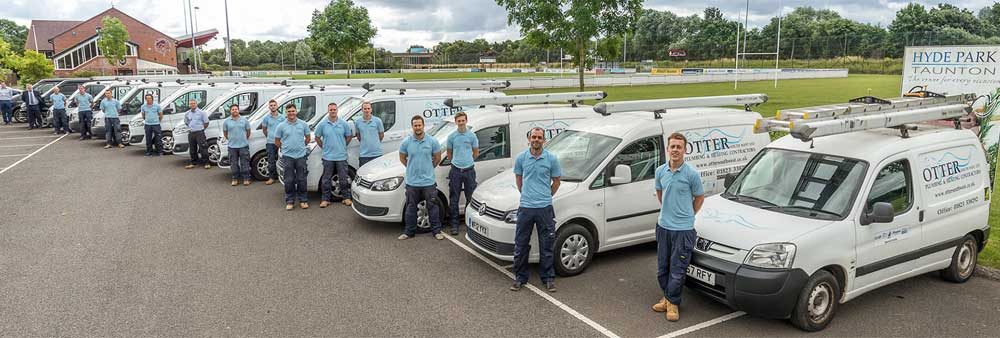 Otter South West Limited team members in front of their vans