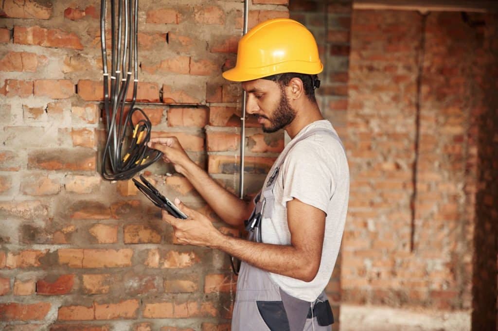 Technician repairs electrical wiring