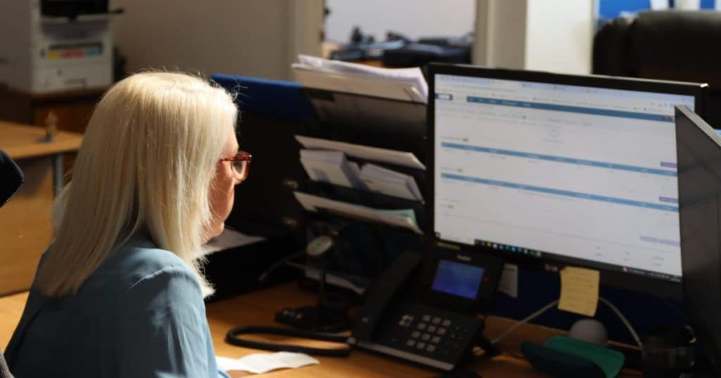 Office worker using Commusoft web app