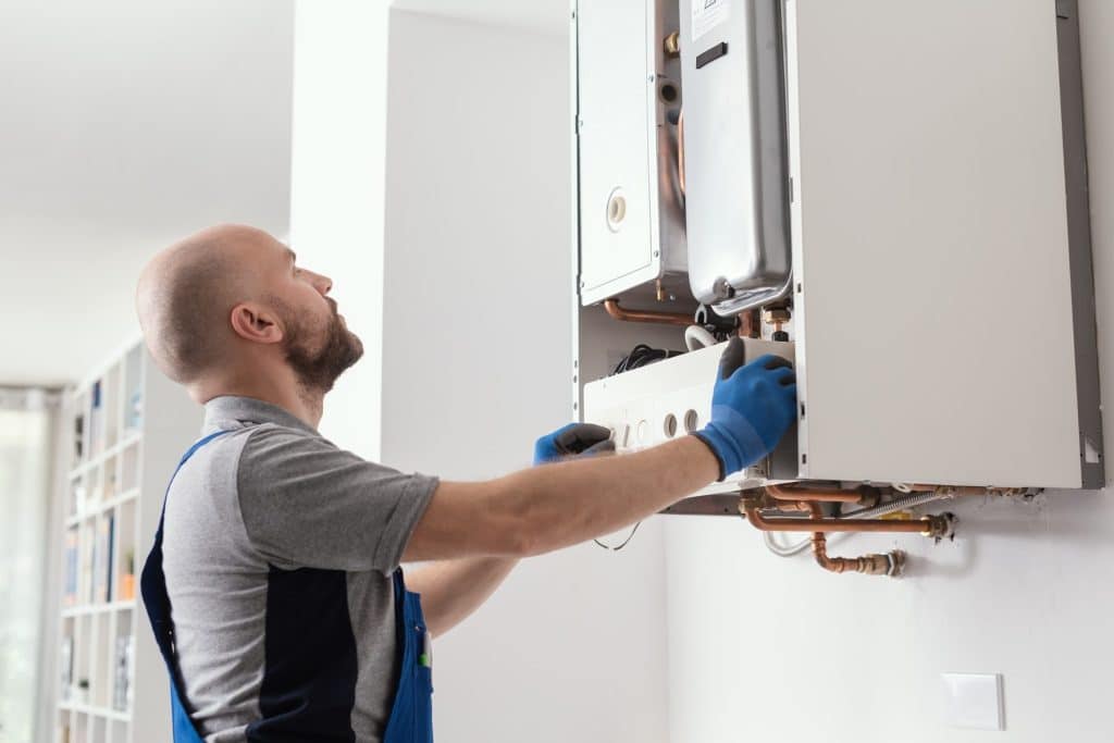 engineer working on boiler installation and maintenance