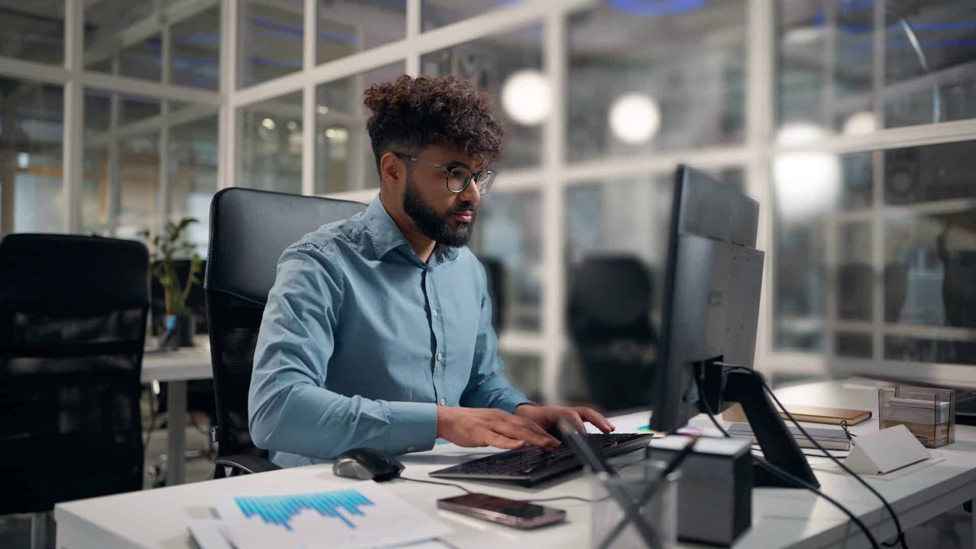 Man working at a computer in a modern office